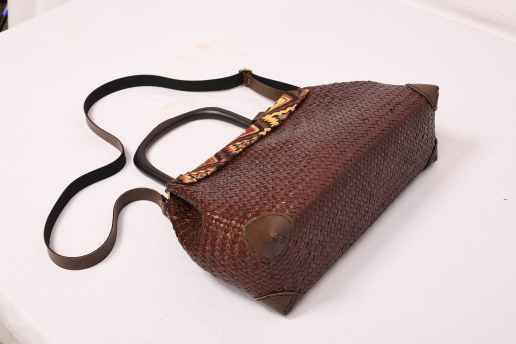 Handbag with fabric flap